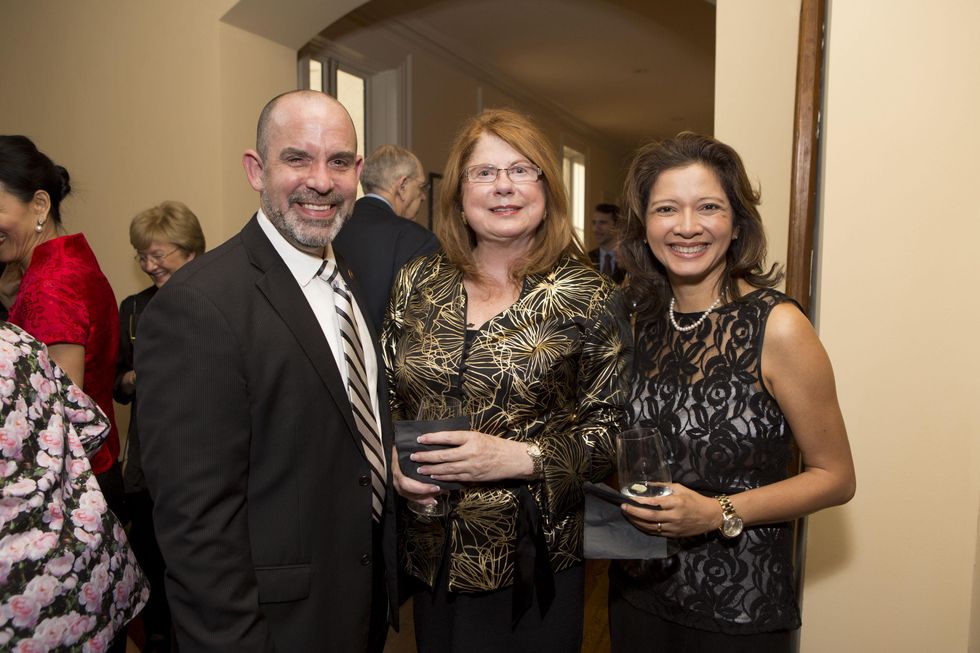 0130 John Bradshaw Jr., from left, Joni Baird and Bonna Kol at the Tiger Ball kickoff party September 2014