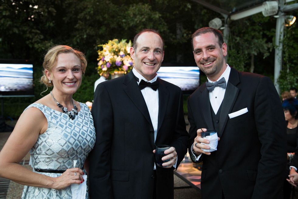1 Angie and Paul DeWeese, from left, with Randy McCall at the Lamborghini party September 2014