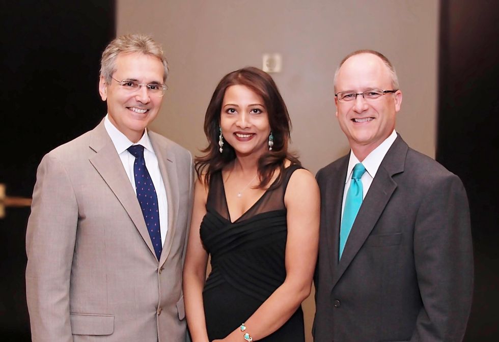 1 Dr. Ronald DePinho, from left, Runsi Sen and Rob Heifner at the Ovarcome Gala May 2014