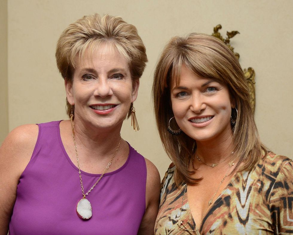 10 Dr. ZoAnn Dreyer, left, and Melissa Wilson at the Celebration of Champions kick-off September 2014