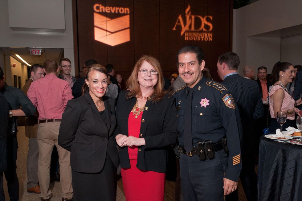 10 Karen Rawls, from left, Joni Baird and Adrian Garcia at the World AIDS Day kick-off October 2014