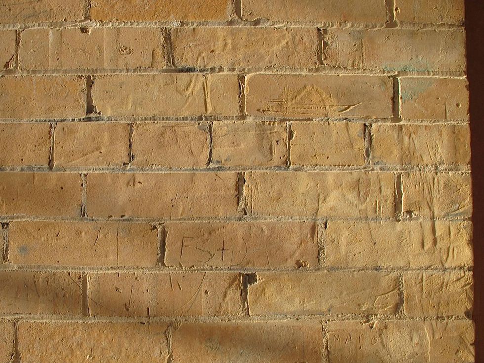 10 Katie The Bryan Museum in Galveston February 2013 Second Floor an interior brick wall on the second floor (late afternoon sunlight coming through)