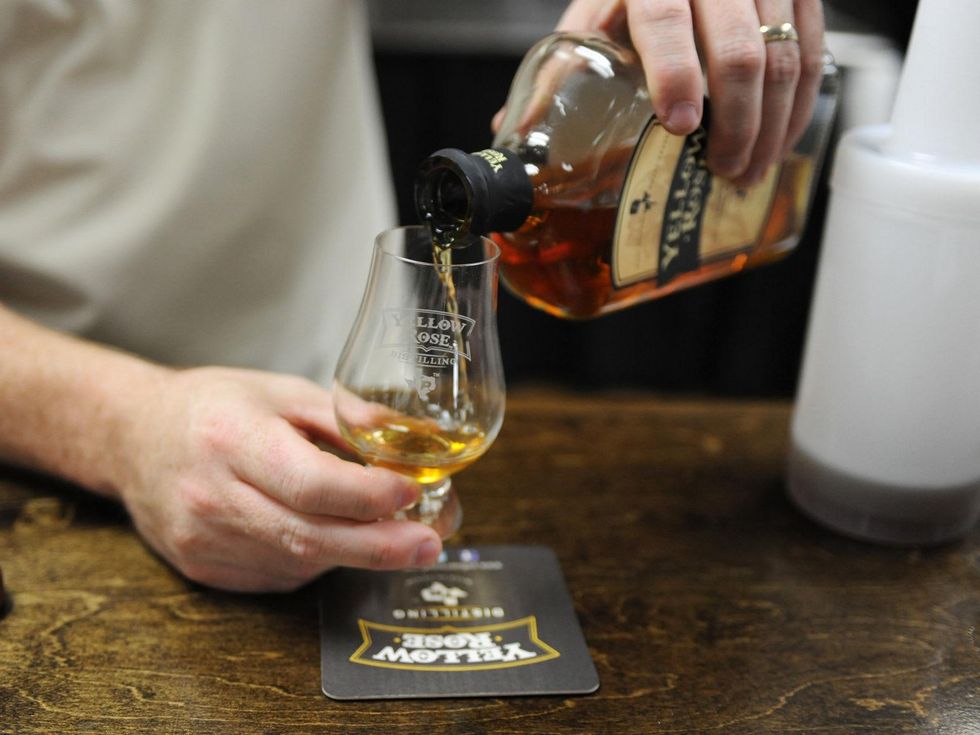 10 Yellow Rose Distilling September 2014 pouring a glass of whiskey