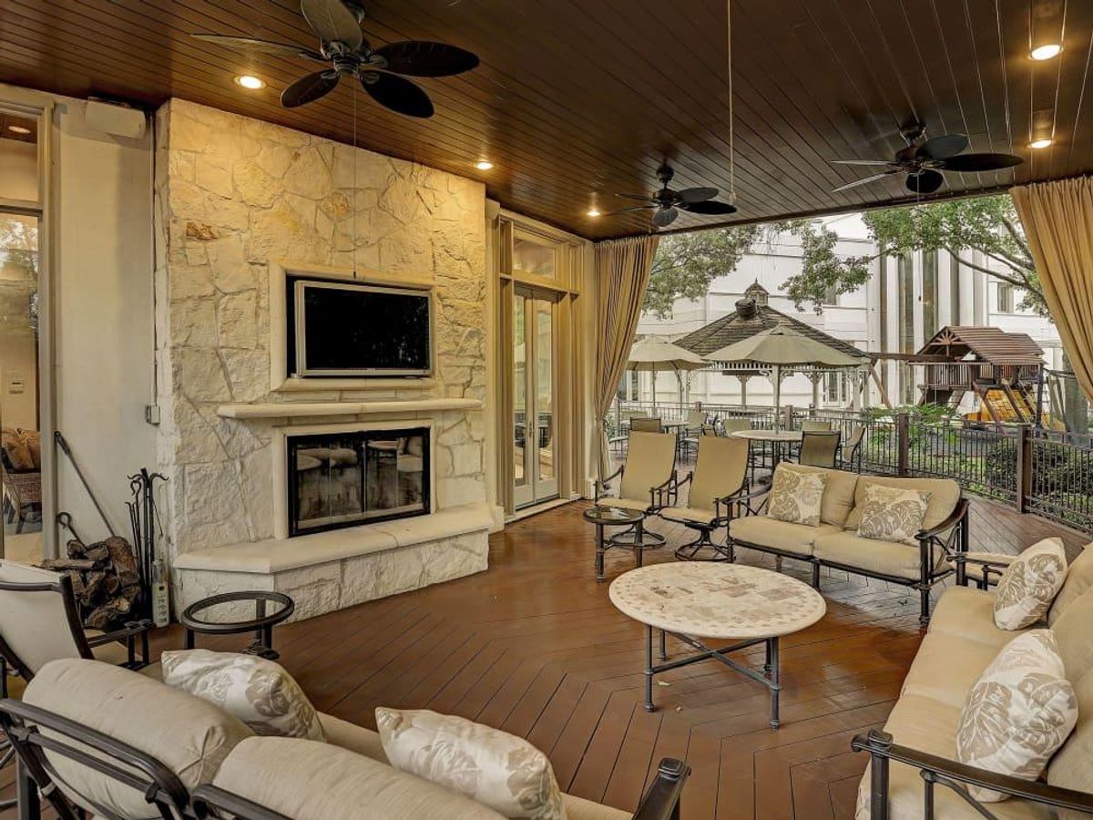 The terrace includes a woodburning fireplace. CultureMap Houston