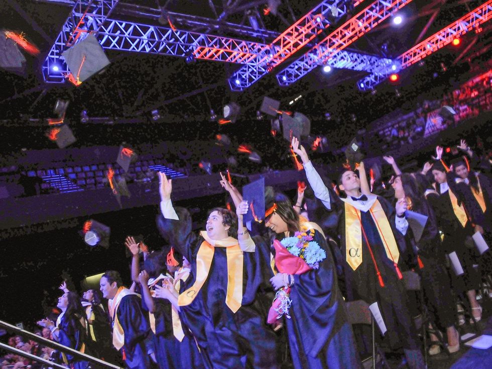 1008 Cristo Rey Jesuit graduation June 2013 Seniors tossing their caps
