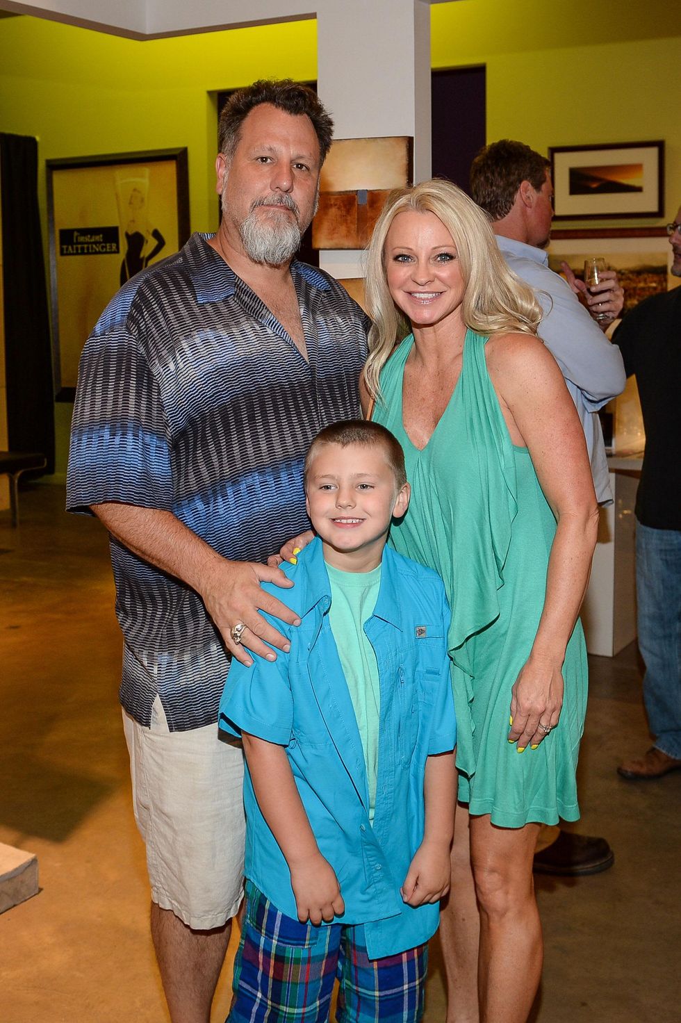 105 Kriss Arbury, from left, Cash Arbury and Debbie Arbury at the HeartGift photo exhibition May 2014