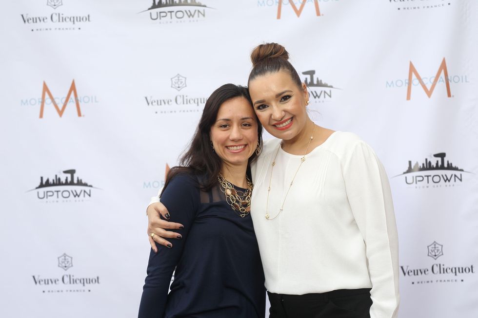 109 Ella Teodorescu, left, and Bianca Huma at the Uptown Blow Dry grand opening in Vintage Park March 2015