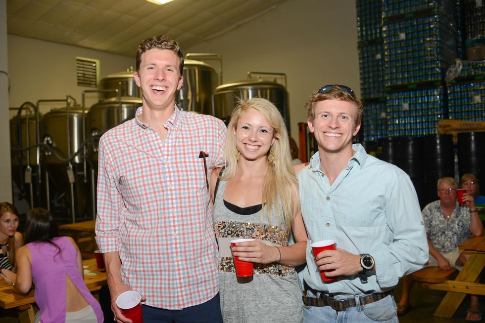 11. Colin Latham, from left, Jennifer Panahi and Guy Harris at the Bayou Preservation Association Herons party June 2014