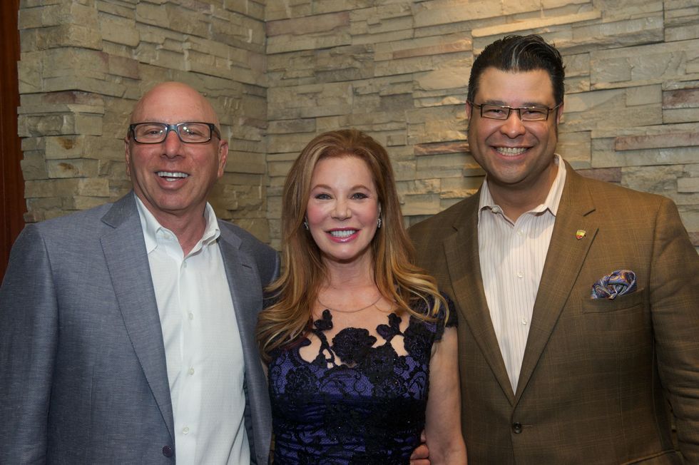 11 Dr. Franklin Rose, and Cindi Rose, from left, with Reuben Rolf at the Holly Rose Ribbon Shades of Roses kick off party July 2014