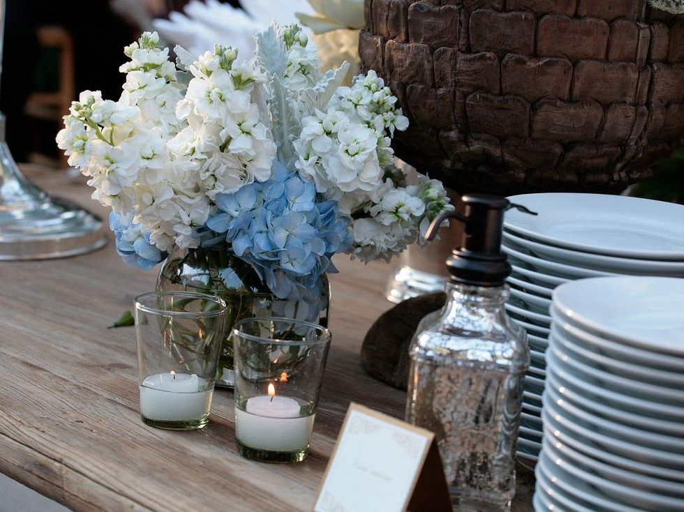 11 flowers and candles at Fraser's Friends dinner