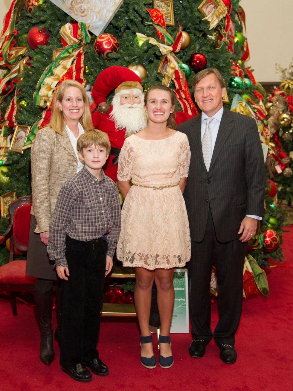 11 Jennifer Ragauss, from left, Andrew Ragauss, Emily Ragauss and Peter Ragauss at the Alley Theatre's Deck the Trees Celebration November 2013