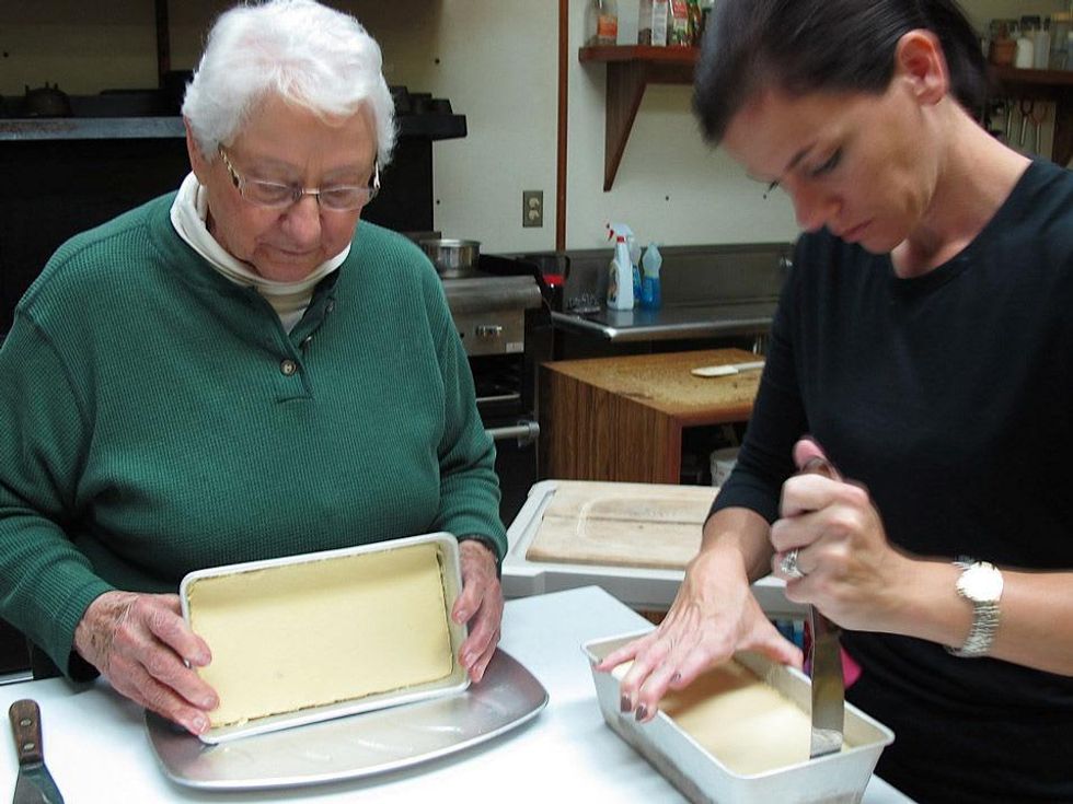11 Katie Louisiana Revisited Part 7 May 2013 Alzina and Jenny preparing to serve flan
