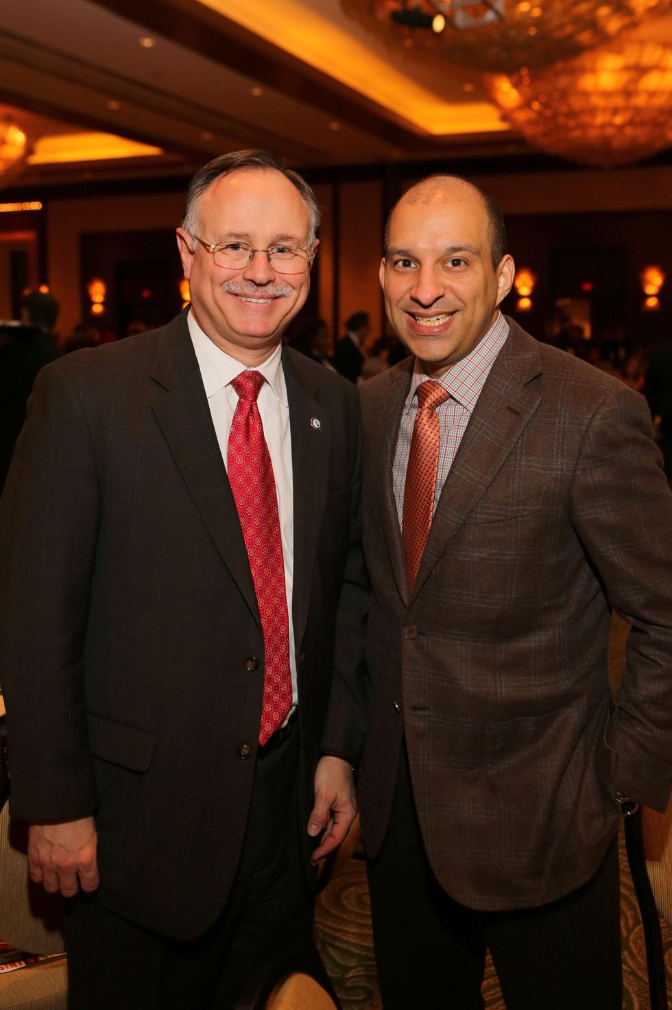 11 Mike Laster, left, and Beto Cardenas at the 1 Million Dollars lunch for Good February 2015
