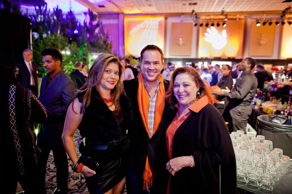 12 Marcy De Luna, from left, Rob Rutherford and Suzy Simons at the Orange Show Gala November 2014