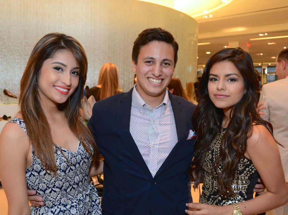 12 Noemi Serrano, from left, William Heartsill and Johanna Coronel at Fresh Faces of Fashion event at Tootsies September 2014
