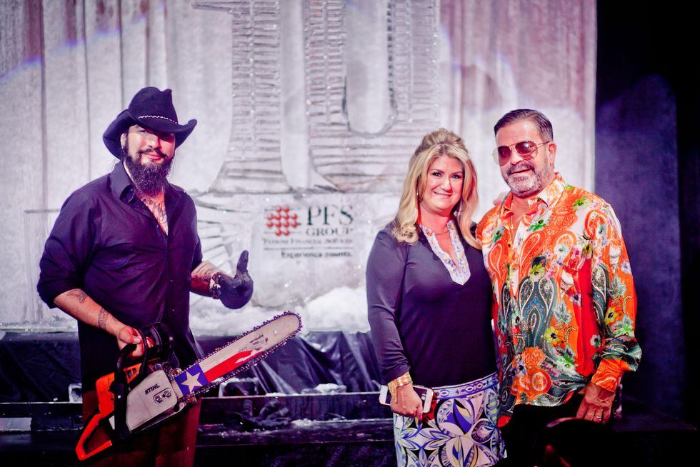 122 Reverend Butter, left, with Debbie and Jeff Gorski at the Patient Financial Services 10th anniversary party April 2015