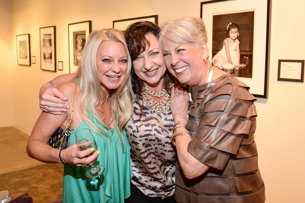 124 Debbie Arbury, from left, Dixie Green and Mary Davenport at the HeartGift photo exhibition May 2014