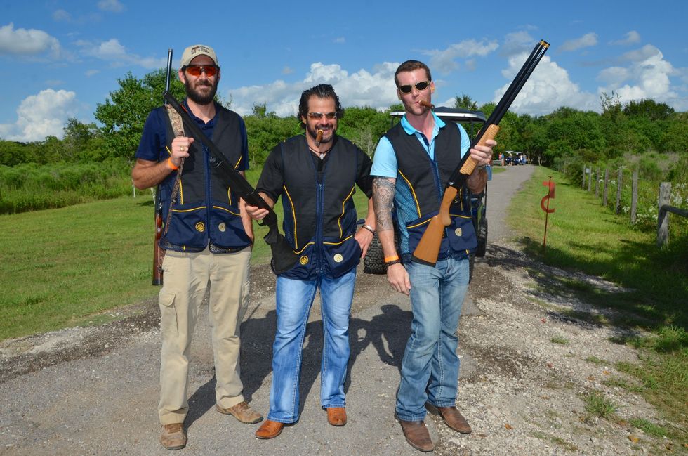 129 Chris Demillano, from left, Justin Smith and Thad Mills at the Backpack Buddies sport shooting event September 2014