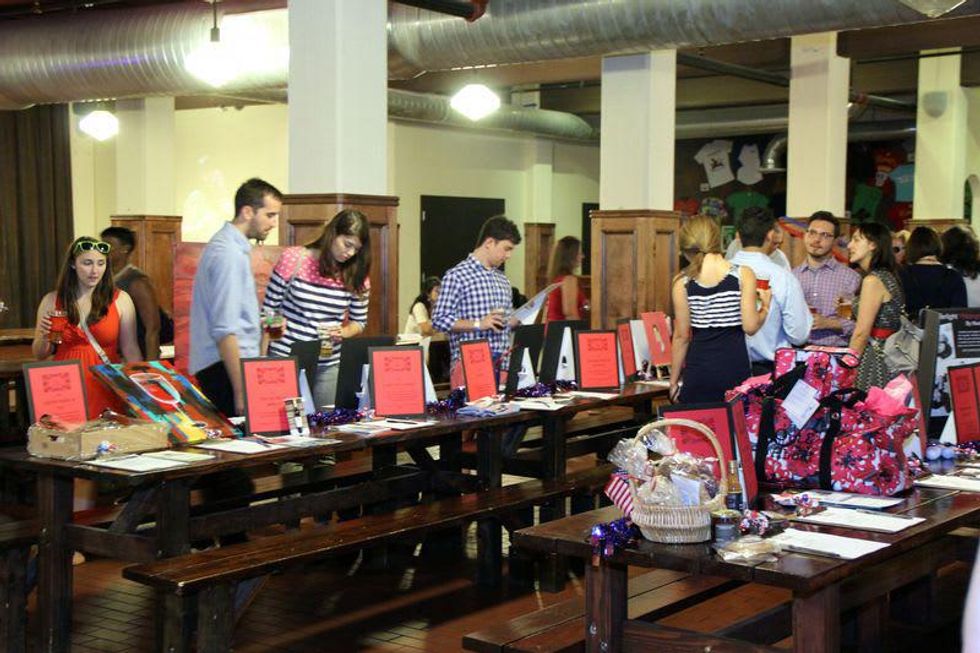 13 Auction table at Houston Area Women's Center Young Leaders Independence Day Bash July 2014