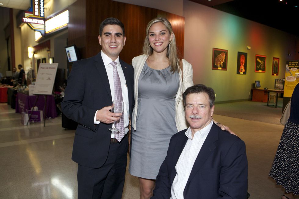 1319 Josh Campos, from left, Kristen Zinser and Michael Leiser at the Passport to the World wine and food event at The Health Museum October 2014