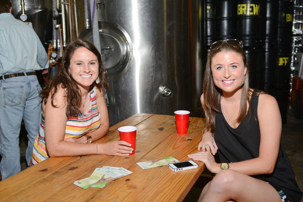 14. Emily Natoli, left, and Megan Lesser at the Bayou Preservation Association Herons party June 2014