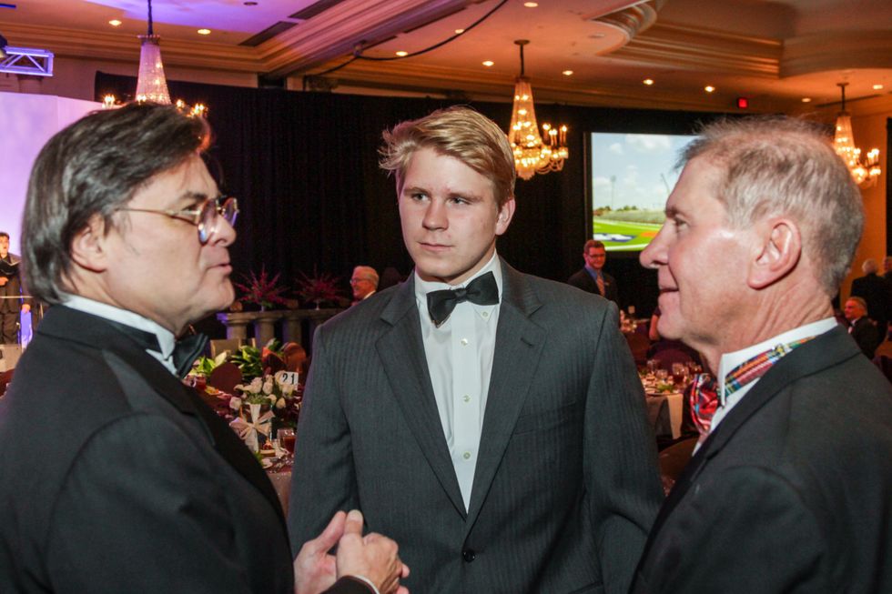 14 Michael Collins, from left, Stewart Morris III and Stewart Morris Jr. at the Houston Baptist University Lou Holtz dinner November 2014