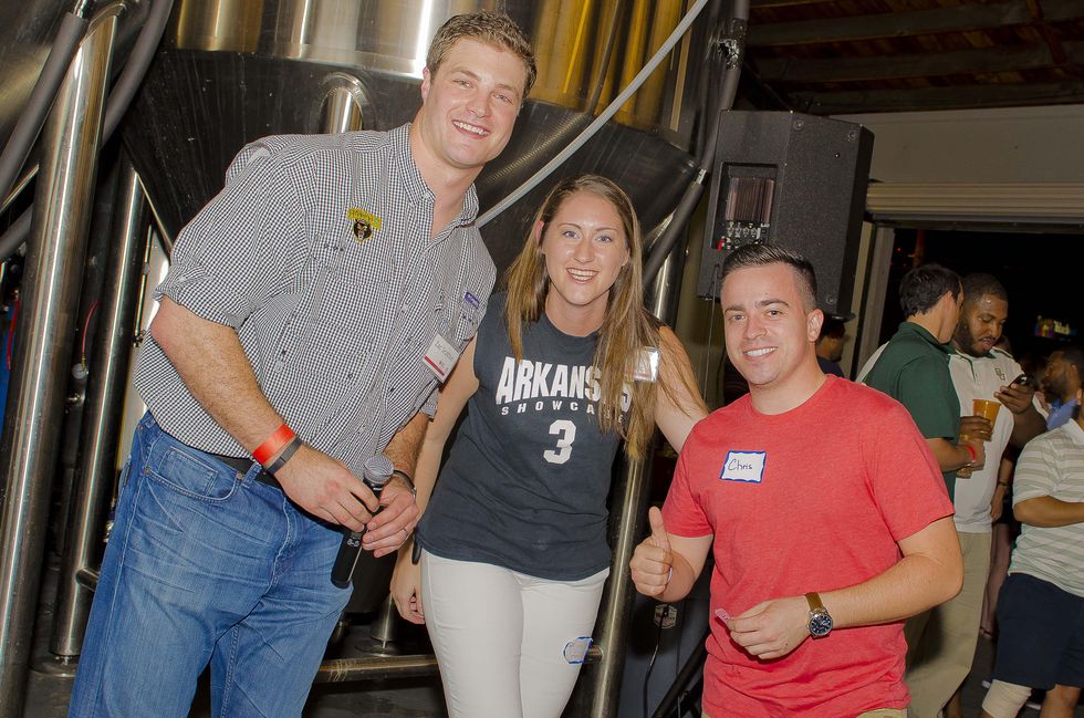 14 Zac Scotton, from left, Catherine Radley and Chris Malzone at the Bear Bryant Awards young professionals party October 2014