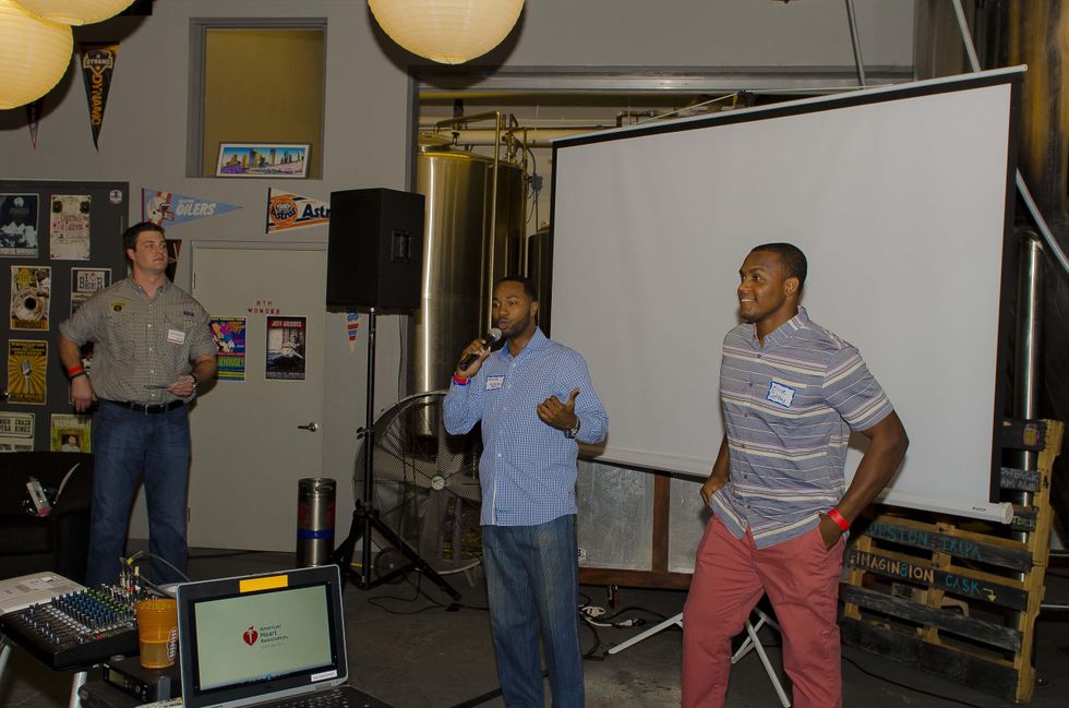 15 Zac Scotton, from left, Mark Haywood and Elliott Coffey at the Bear Bryant Awards young professionals party October 2014