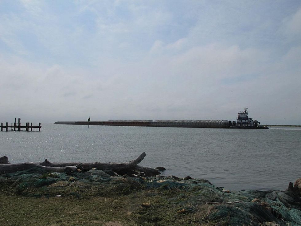 16 Katie Oxford Galveston birds and the oil spill April 2014 Barge moving on Intracoastal Waterway like a giant Gillette razor blade