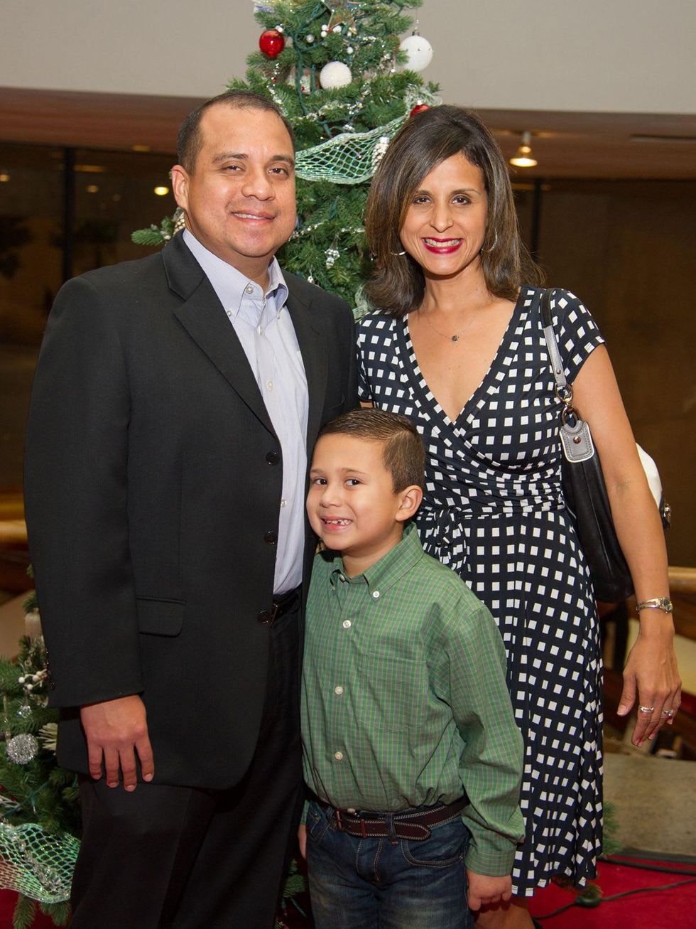 16 Tony Sanchez, from left, Evan Sanchez and Kathy Sanchez at the Alley Theatre's Deck the Trees Celebration November 2013