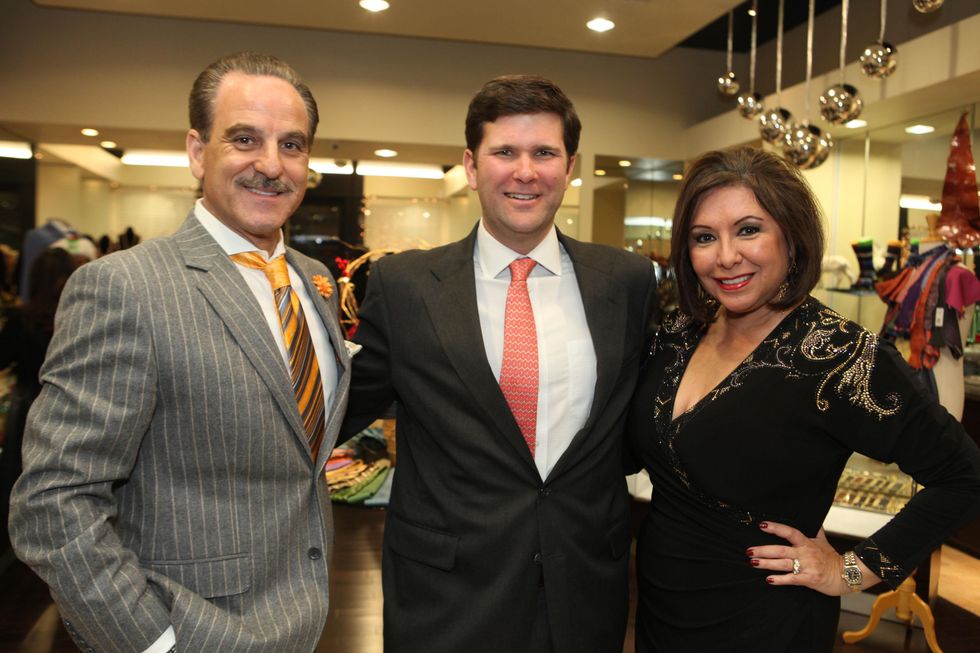 1664 Rudy Festari, from left, Charlie Neuhaus and Debbie Festari at the Festari for Men Christmas Party December 2013