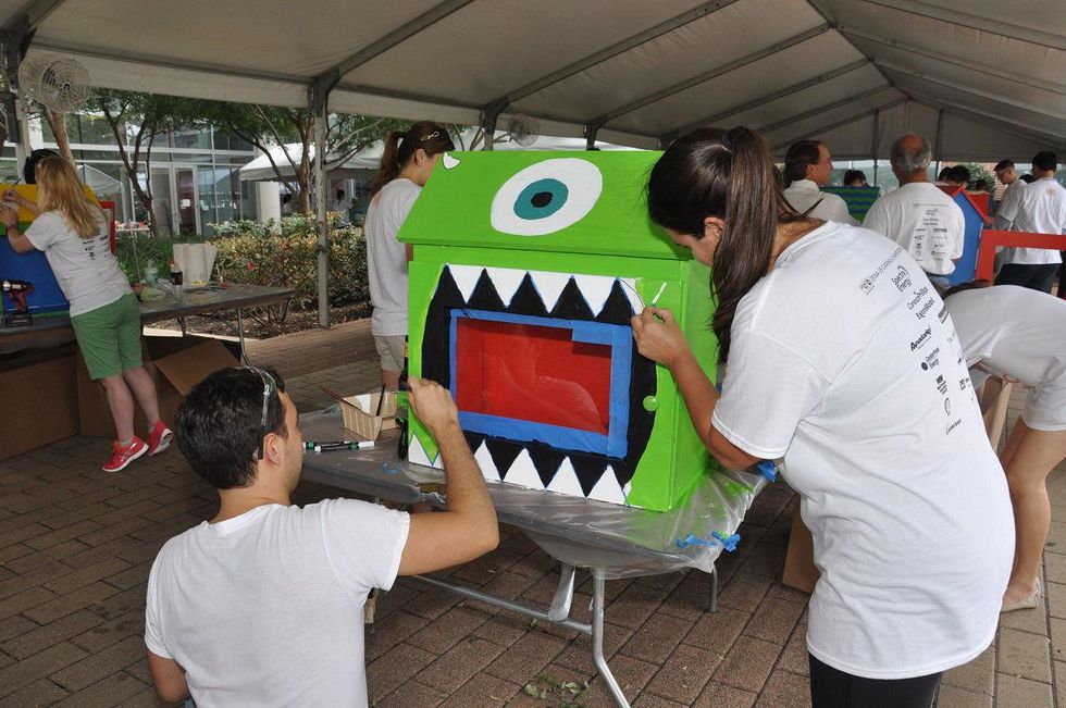 17 A \u201cMonster\u2019s Inc.\u201d themed tiny library at young professionals build Tiny Libraries September 2014