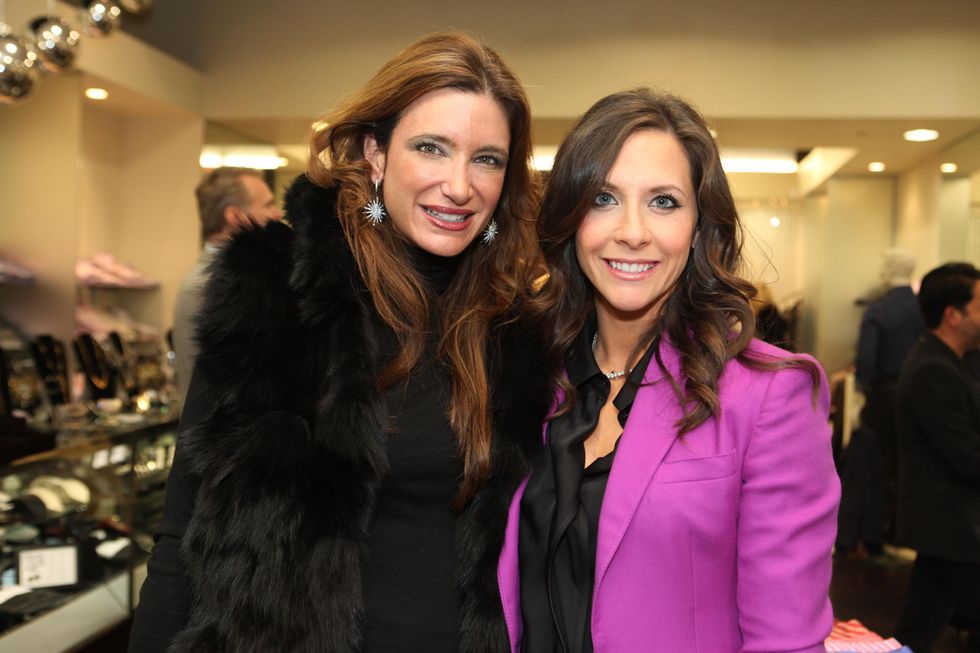 1750 Melissa Mithoff, left, and Hannah McNair at the Festari for Men Christmas Party December 2013