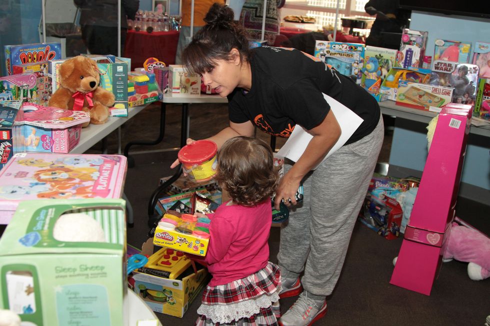 18 A patient picks out a toy at the holiday party at Santa visits Texas Children's Cancer Center December 2014