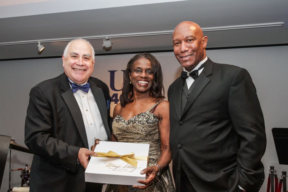 18 Bill Flores, left, with Clarease and Cary Yates at the UH Downtown 40th anniversary gala January 2015