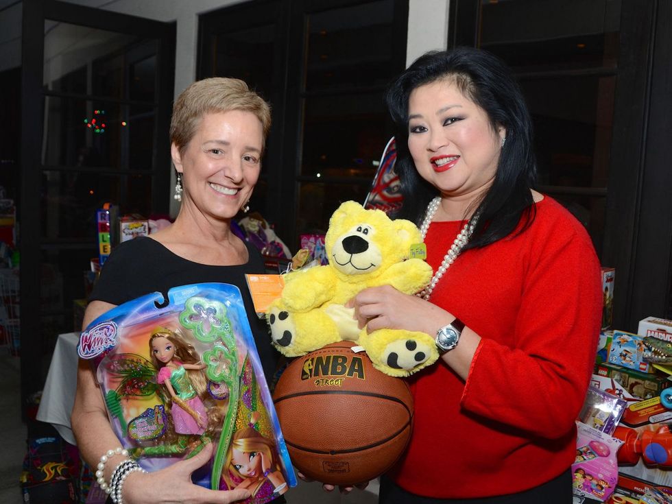 19 Brenda Koch, left, and Gigi Huang at Joyful Toyful December 2014