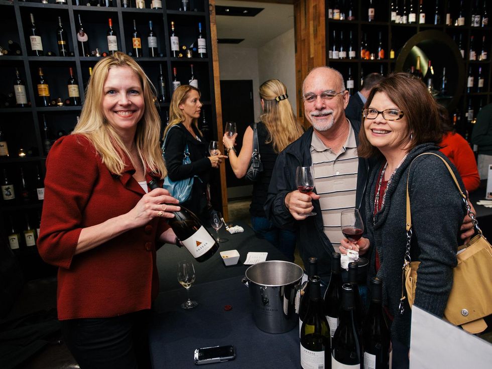 19 Danielle Ramdazo, from left, with Michael and Leticia Shelley at the Artesa wine tasting at Cru March 2014