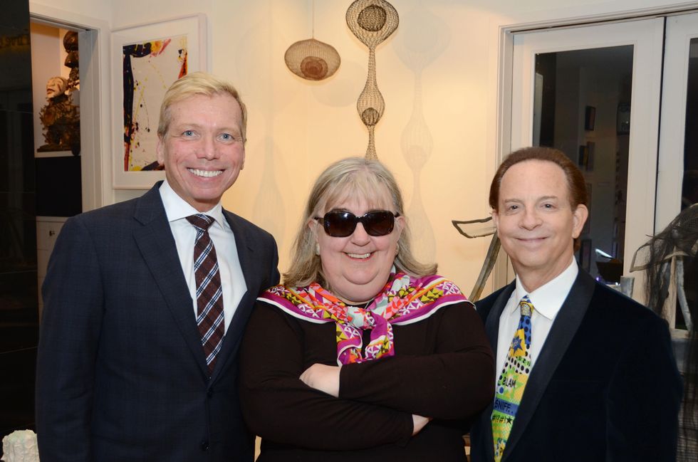 2 10 Jonathon Glus, from left, Cindy Clifford and Lester Marks at the Rick Lowe Party December 2014