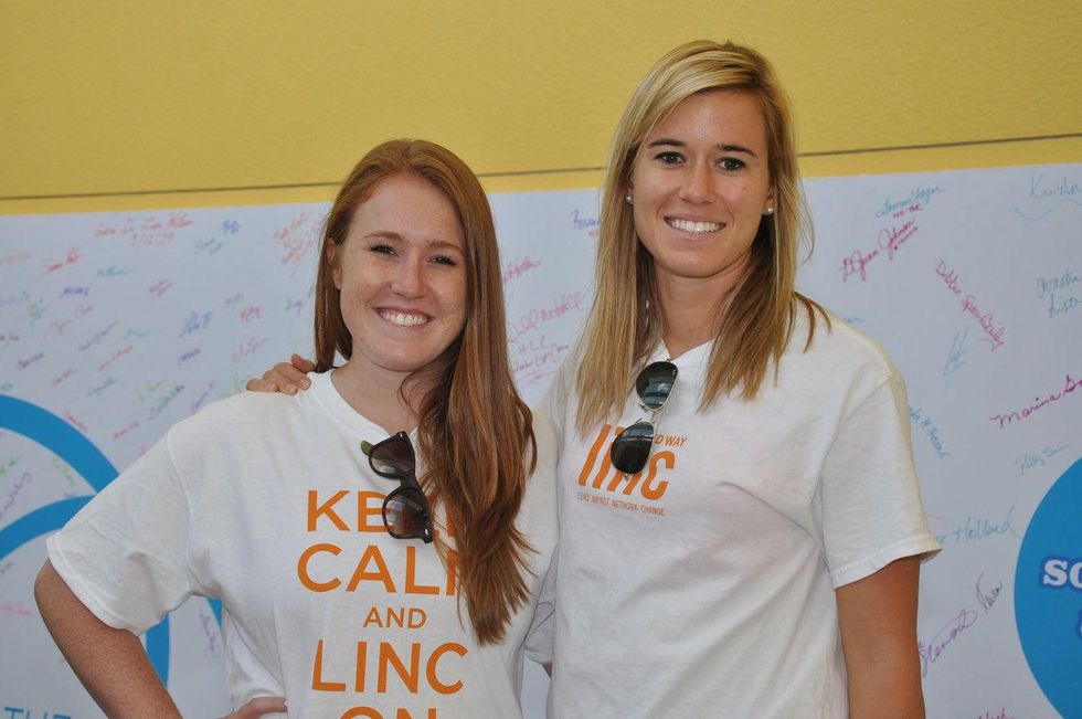 2 Kaci Bramhall, left, and Lisa Jett at young professionals build Tiny Libraries September 2014
