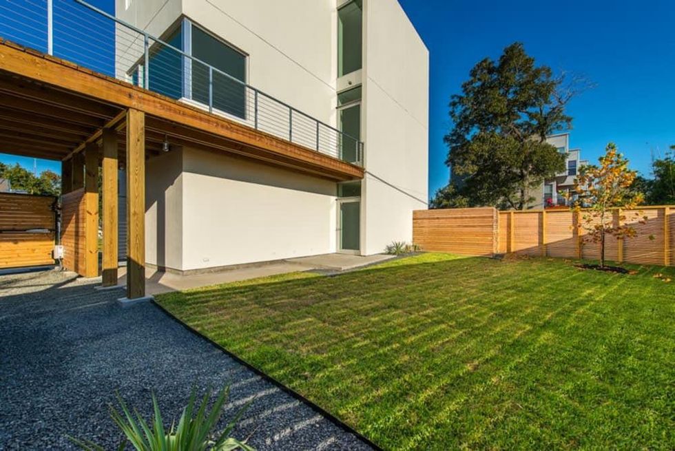 2 On the Market 3000 Hawkins St. December 2014 view of yard and side of house to entry