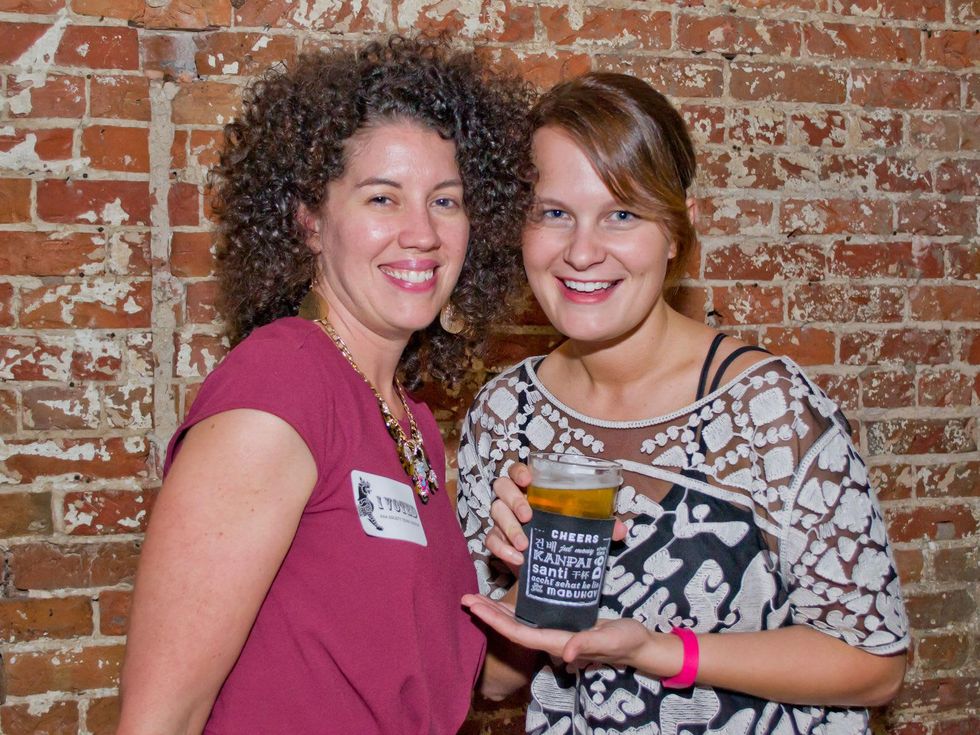 20 Megan Raines, left, and Bronwyn Walker at the Young Professionals Grand Prix kick-off party June 2014
