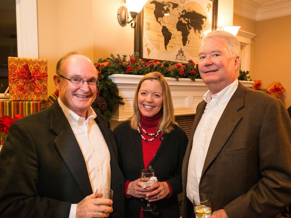 2063 24 John and Karen Vandy, from left, with Alec Mize at the Joiner holiday party December 2013