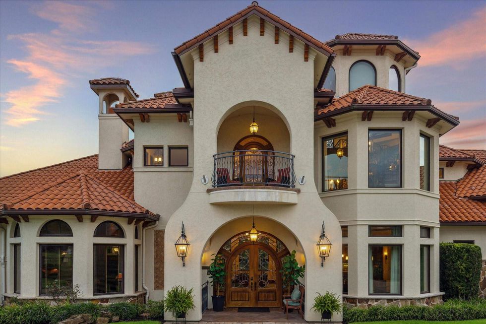 21538 Mueschke Road exterior, showing a balcony and curved entry doors