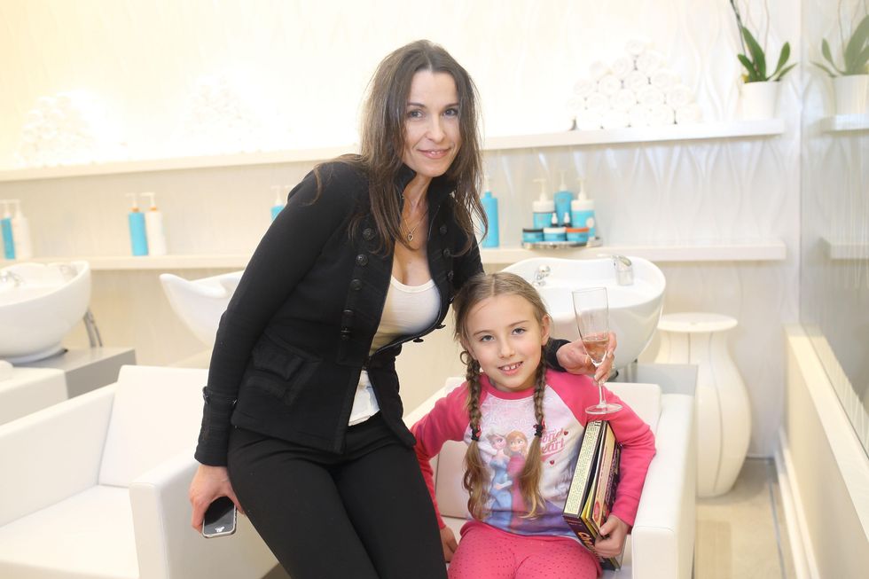 218 Oksana Duke, left, and Evelina Duke at the Uptown Blow Dry grand opening in Vintage Park March 2015