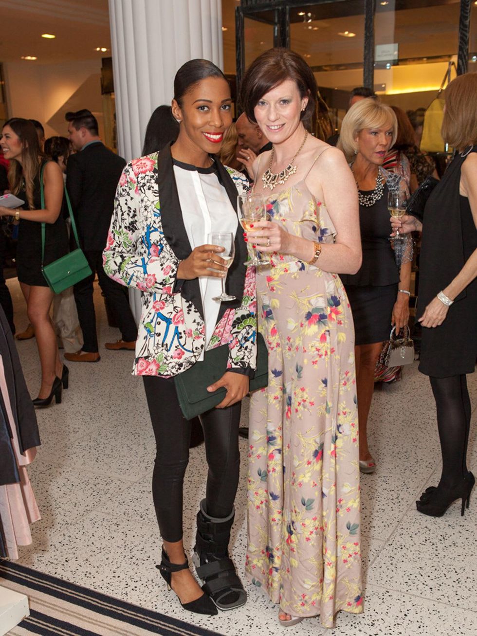 22. Angela Johnson, left, and Christine Kearns at the Little Black Dress designer kick-off party and fashion show March 2014