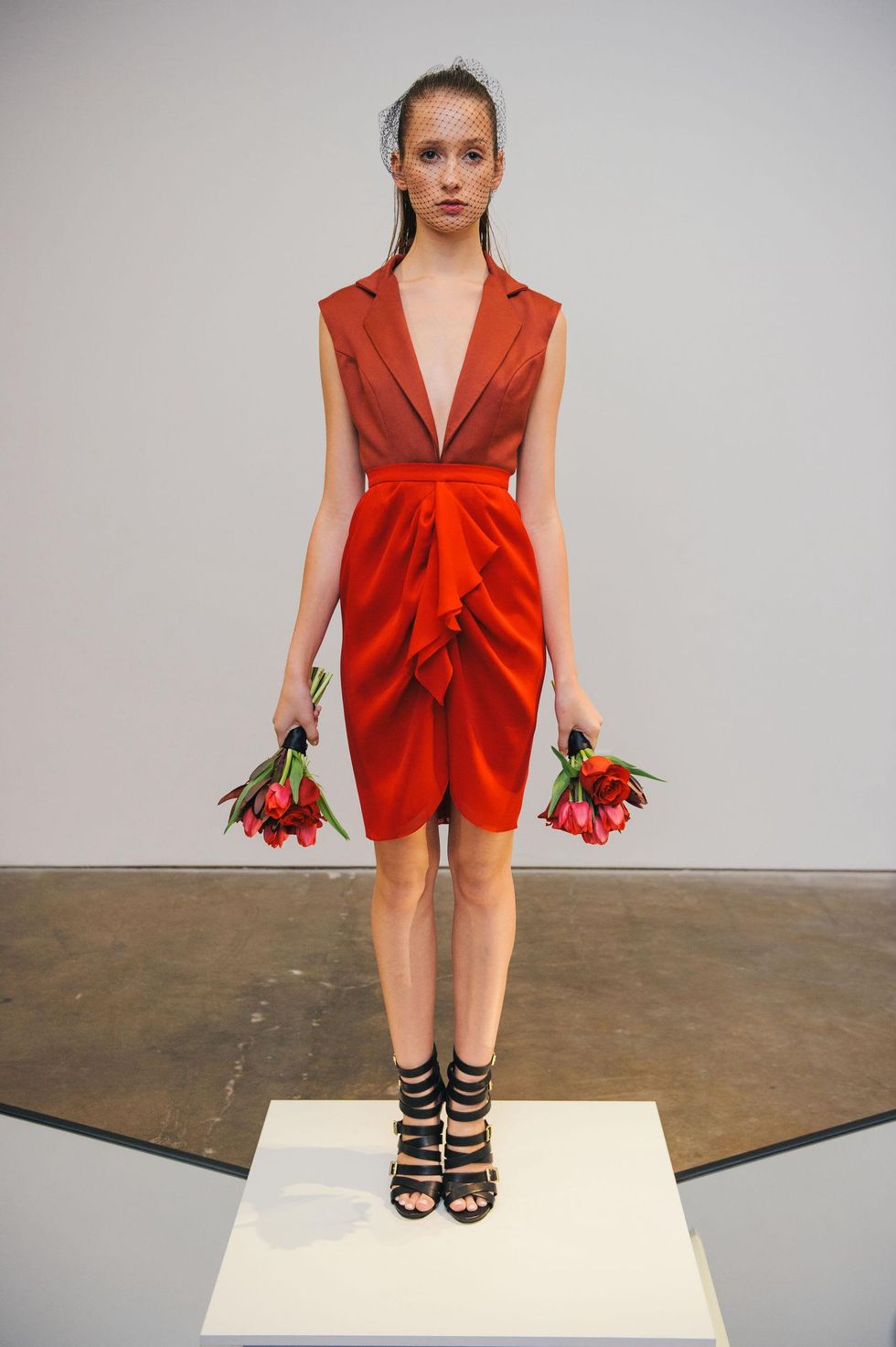 22 Model in satin gaberdine tailerd top with draped skirt at the Amir Taghi launch May 2014