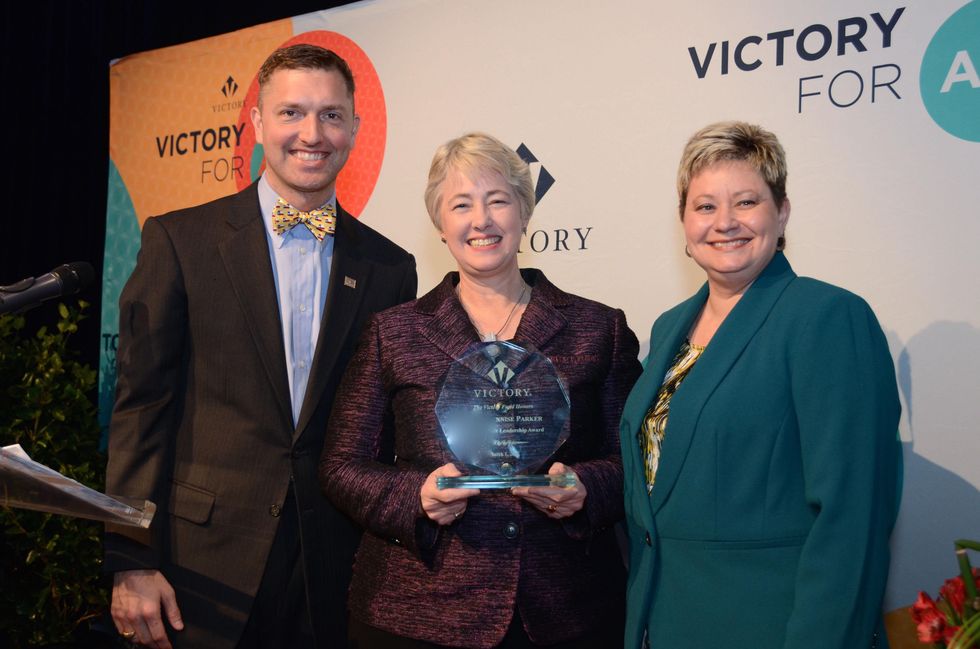 221 Ryan Lindsay, from left, Mayor Annise Parker and Tammi Wallace at the Victory Brunch March 2015