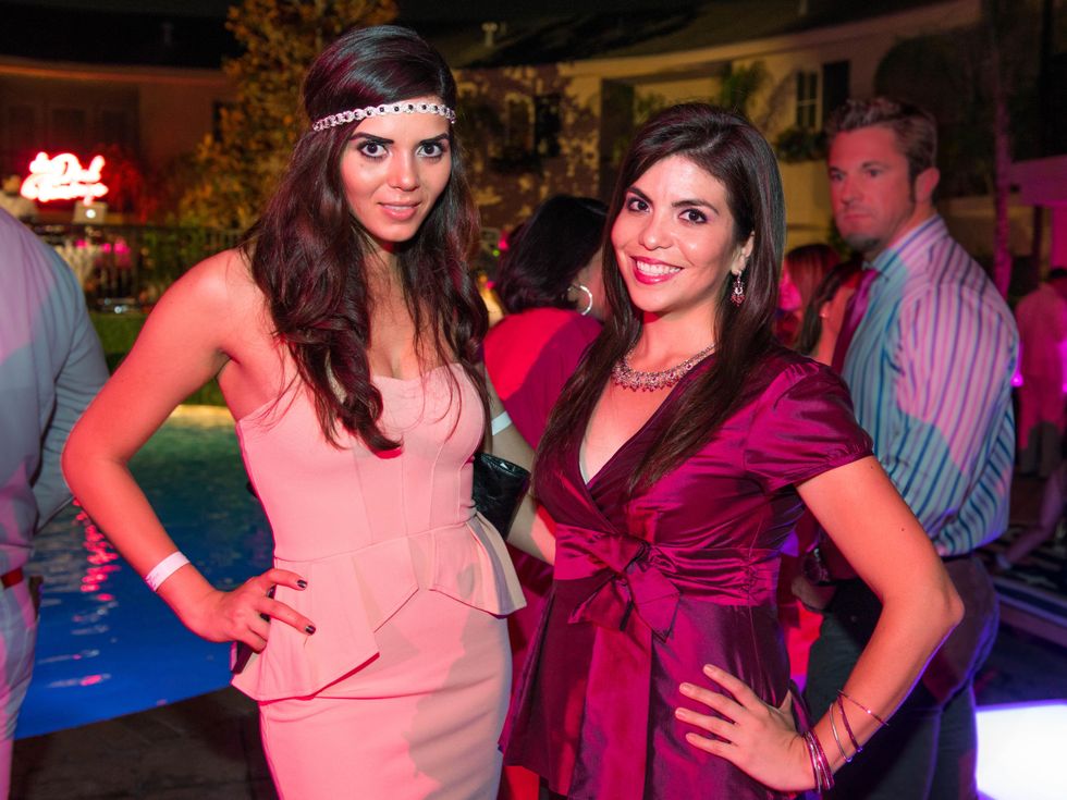 25 Iris Alvarez, left, and Ary Ruiz at the Pink Party at Hotel ZaZa July 2014