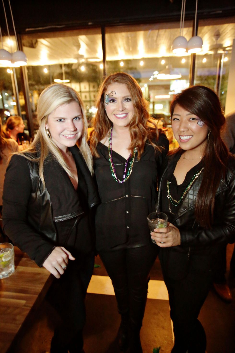 25 Taylor Harper, from left, Trevor Thompson and Mi-Sun Bae at Gray\u2019s Public House Mardi Gras grand opening benefiting Urban Green February 2015