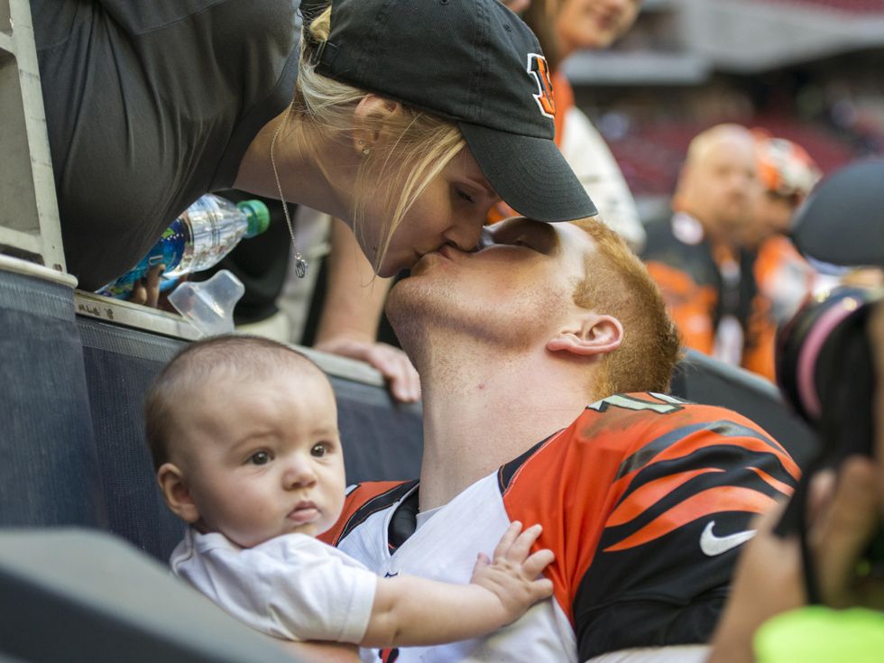 25 Texans vs. Bengals Andy Dalton after the game\u2026He went over to the sidelines and his wife Jordan came down, handed him their son, Noah and then kissed him